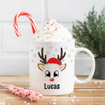 Cute Reindeer Boy Santa Hat Custom Name Christmas Coffee Mug<br><div class="desc">Cute Christmas coffee or hot cocoa mug features an illustration of a sweet Rudolph reindeer boy face with a shiny red nose, eyelashes, and antlers. He is dressed up with a red Santa Claus hat and surrounded by light grey snowflakes. Personalise this festive hot chocolate mug with a first name...</div>