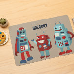 Cute Retro Robots Personalised Sci-Fi Laminated Place Mat<br><div class="desc">Add a sci-fi touch to your table with this placemat. It features cute retro style illustrations of robots in shades of red and blue against a tan coloured background. The front of the place mat has a spot at the top to add a name. The reverse side has a coordinating...</div>