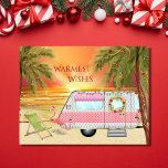 Cute RV Camper Warmest Wishes Beach Christmas Holiday Postcard<br><div class="desc">This Warmest Wishes holiday Christmas greeting card features a cute RV Camper at the beach. It is decorated with lights, a wreath and two pink Santa flamingo yard decorations. The camper is surrounded by palm trees with festive holiday lights and in the background the sun is setting (or rising) over...</div>