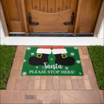 Cute Santa Please Stop Here Christmas Entryway Doormat<br><div class="desc">Welcome the holiday season with our "Santa Please Stop Here" Door Mat. Featuring a cartoon illustration Santa Claus holding presents and white snowflakes,  this festive mat adds a cheerful touch to your entryway. (c) The Happy Cat Studio.</div>