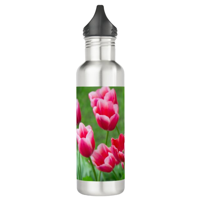 Cute scarlet tulips in the garden 710 ml water bottle (Left)