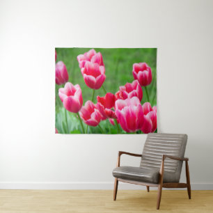 Cute scarlet tulips in the garden tapestry