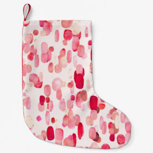Cute seamless pattern of pink, red and beige spots small christmas stocking