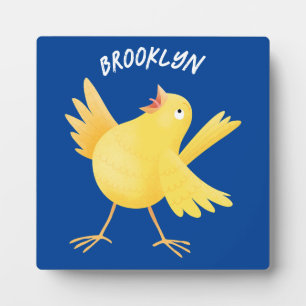 Cute singing yellow canary bird cartoon plaque