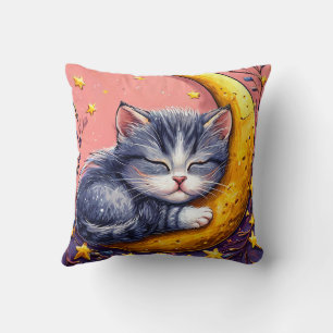 Cute sleeping cat resting on a crescent moon cushion