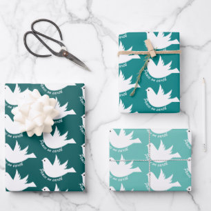 Cute snowman and snow on teal blue wrapping paper 