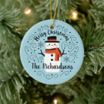 Cute Snowman Christmas Ceramic Ornament<br><div class="desc">A cute Christmas snowman with the words Merry Christmas decorates this ornament. Personalise it with your family name. A fun accent for the Christmas holiday season. Designed for you by Blackberry Boulevard.</div>