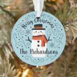 Cute Snowman Christmas Ceramic Ornament<br><div class="desc">A cute Christmas snowman with the words Merry Christmas decorates this ornament. Personalise it with your family name. A fun accent for the Christmas holiday season. Designed for you by Blackberry Boulevard.</div>