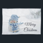 Cute Snowman in Winter Photograph Christmas Tea Towel<br><div class="desc">A kitchen towel with a cute photograph with a little snowman. Standing outside in the winter with snow falling all around. This cute little guy is dressed up in blue knitted outdoor clothing. Some white/grey bokeh flare in the background.</div>