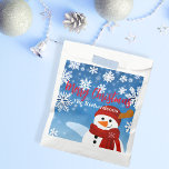 Cute Snowman Winter Wonderland Merry Christmas Favour Bag<br><div class="desc">Experience the joy of giving with our personalised Christmas favour bag. This charming favour bag, adorned with a jovial snowman set against a serene blue backdrop, captures the magic of a white Christmas. Each snowflake surrounding the snowman adds a touch of winter wonder, making it an enchanting sight to behold....</div>