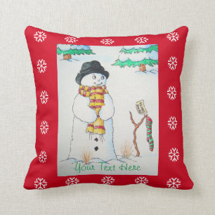 Cute snowman with Christmas stocking in the snow Cushion