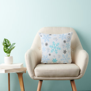 Cute snowmen and snowflakes in light blue cushion