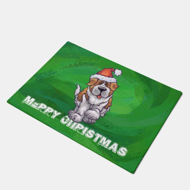 Cute St. Bernard in Santa Hat on Green Doormat (Angled)