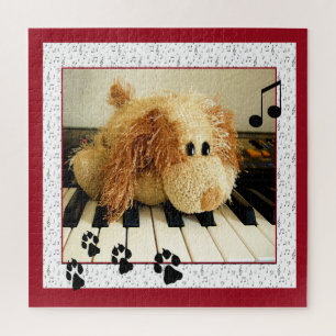 Cute toy dog playing the keyboard jigsaw puzzle
