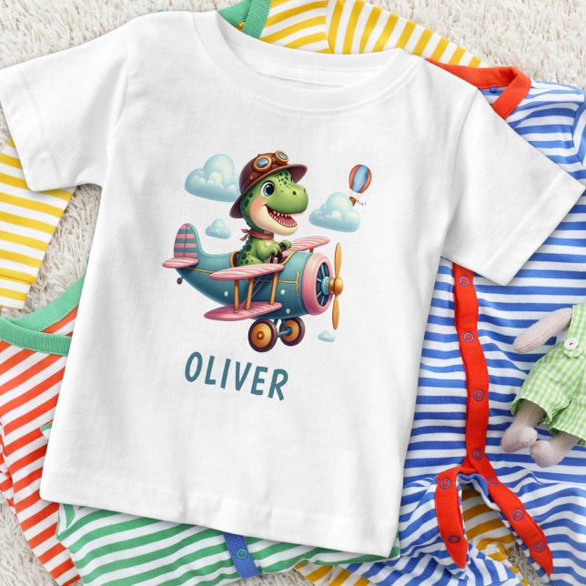 Cute Trex Dinosaur Flying a Charming Aeroplane Baby T-Shirt (Creator Uploaded)