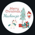 Cute Unicorn and Fairy Custom Name Merry Christmas Classic Round Sticker<br><div class="desc">These holiday sticker labels feature a colourful fairytale theme. A festive unicorn is pictured standing beside a Christmas tree and gifts. A cute little fairy is fluttering beside the tree. A sample Merry Christmas greeting is printed in a whimsical red font above the unicorn, followed by a name in green....</div>