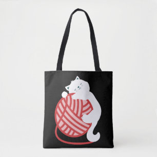 Cute white cat with yarn ball tote bag