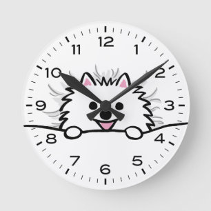 Cute White Pomeranian Tucked in Bed Round Clock