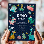Cute Winter Christmas Dino Kids Birthday Party Invitation<br><div class="desc">Celebrate your child's birthday with our Christmas Winter Dino Party invites! This cute birthday party design features a frame of colourful dinosaurs, dressed in hats and scarfs bearing gifts and your custom party details in modern typography against a navy blue background. Simply personalise the birthday party invites by adding your...</div>