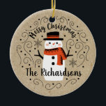 Cute Winter Christmas Snowman Ceramic Ornament<br><div class="desc">A cute Christmas snowman with the words Merry Christmas decorates this ornament. Personalise it with your family name. A fun accent for the Christmas holiday season. Designed for you by Blackberry Boulevard.</div>