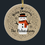 Cute Winter Christmas Snowman Ceramic Ornament<br><div class="desc">A cute Christmas snowman with the words Merry Christmas decorates this ornament. Personalise it with your family name. A fun accent for the Christmas holiday season. Designed for you by Blackberry Boulevard.</div>
