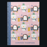 Cute Winter Penguins Snowman Pink Personalised Notebook<br><div class="desc">Make note-taking fun and festive with this adorable personalised notebook featuring cheerful penguins, snowmen, and colourful presents! Set against a pastel pink background with a contrasting blue spine, this whimsical design is perfect for kids or anyone who loves wintertime charm. Add your name or a special gift recipient's name for...</div>