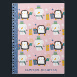 Cute Winter Penguins Snowman Pink Personalised Notebook<br><div class="desc">Make note-taking fun and festive with this adorable personalised notebook featuring cheerful penguins, snowmen, and colourful presents! Set against a pastel pink background with a contrasting blue spine, this whimsical design is perfect for kids or anyone who loves wintertime charm. Add your name or a special gift recipient's name for...</div>