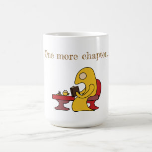Cute yellow monster reading in a cafe coffee mug