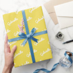 Cute Yellow White Personalised Script Name   Wrapping Paper<br><div class="desc">This cute wrapping paper features a colourful pattern of your name in modern cursive writing in yellow and white.</div>