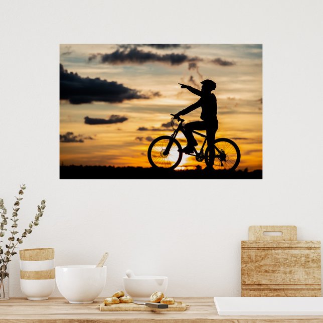 Cyclist Poster (Silhouette of a man on a bicycle, wearing a helmet, pointing to the right, sunset background.)