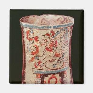 Cylindrical depicting a deity with speech curls magnet