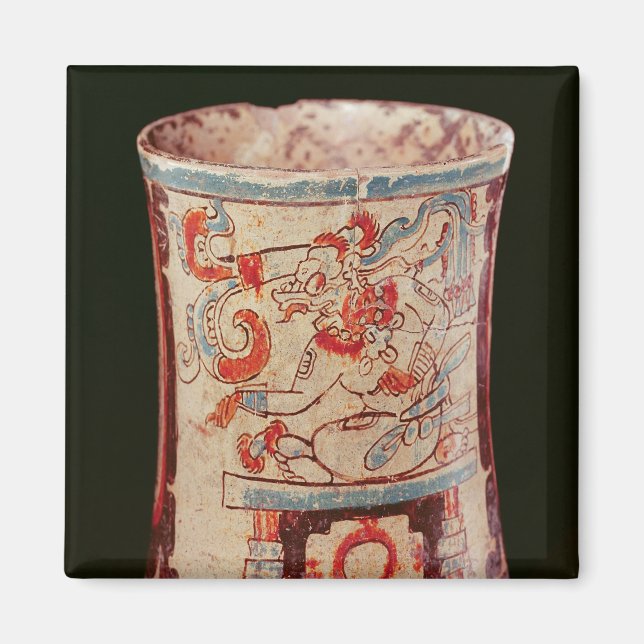 Cylindrical depicting a deity with speech curls magnet (Front)