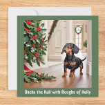 Dachshund Cute Doxie Picture Funny Dog Christmas Holiday Card<br><div class="desc">A funny greeting card for Christmas with dachshund picture. The cute pup is looking at festive holly, with the caption 'Dachs the Hall with Boughs of Holly', a play on the title of the traditional song 'Deck the Hall... ' Sure to appeal to dog lovers (and who doesn't love a...</div>