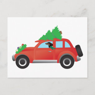Dachshund driving a car w/ a Christmas tree on top Holiday Postcard