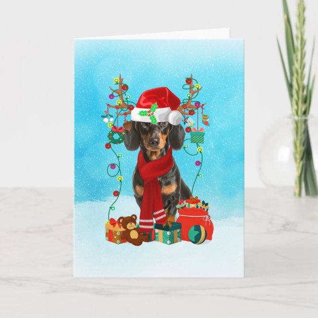 Dachshund in snow with Christmas gifts Card (Front)