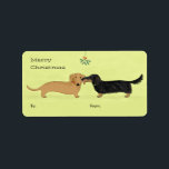 Dachshund Mistletoe Kiss - Wiener Dog Christmas Label<br><div class="desc">Cute red Dachshund and longhaired black and tan Dachshund kiss under the mistletoe. A sheet of to and from labels to stick on all your holiday gifts. After you’ve taken the care to gift wrap your Christmas presents, these cute wiener dog labels are the perfect touch. Visit Jenn’s Doodle World...</div>