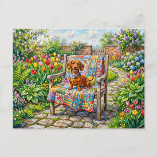 Dachshund Sitting on Patchwork Garden Chair Among Postcard