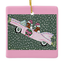 Dachshunds at Christmas in a pink convertible