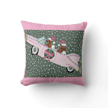 Dachshunds at Christmas in a pink convertible