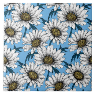 Daisies, wild flowers on blue ceramic tile