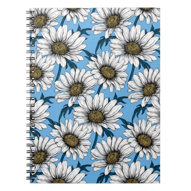 Daisies, wild flowers on blue notebook (Front)