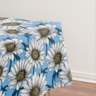 Daisies, wild flowers on blue tablecloth