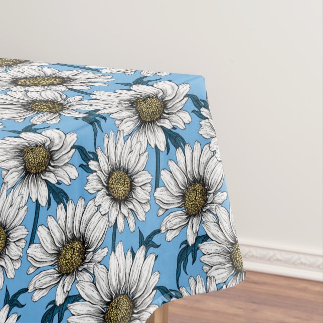 Daisies, wild flowers on blue tablecloth (In Situ)