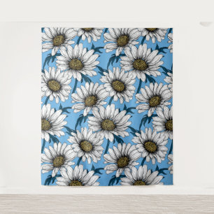 Daisies, wild flowers on blue tapestry