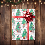 Dalmatian Dog Christmas Pattern Wrapping Paper<br><div class="desc">There's a beautiful Dalmatian dog featured on this Holiday wrapping paper. The dog wears a red and white Santa hat, and sits in front of a decorated Holiday tree. The image is repeated across the surface, and there are red snowflakes and striped candy canes between the images. Also between the...</div>