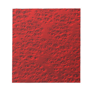Damaged red metal notepad