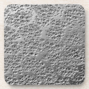 Damaged silver metal coaster