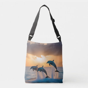 Dancing in the Dusk: Three Dolphins Leaping Crossbody Bag