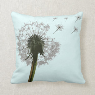 Dandelion blowing, seeds scattering pillows