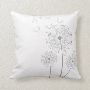 Dandelion flower on pure white cushion